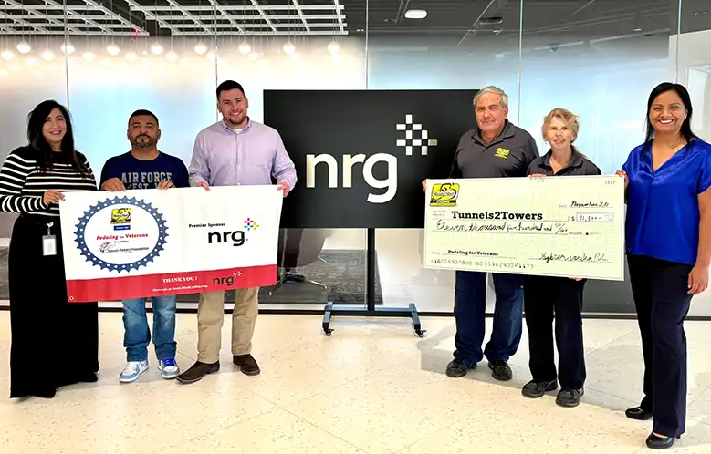 Ready2Roll Cycling presenting a donation check to Tunnels2Towers with NRG and Petaling for Veterans